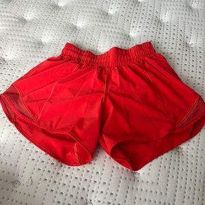LuluLemon red/orange hotty hot shorts (size 2)